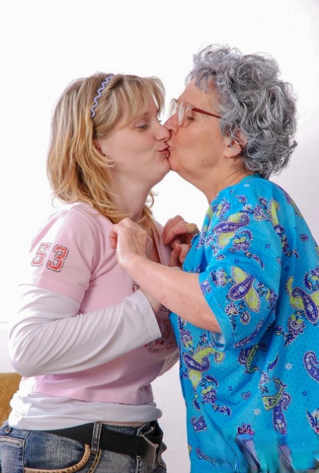 Big boobed teen fucks a curly haired granny with a yellow sex toy
