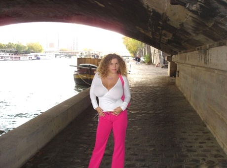 Curly haired babe Angel Crisa exposes her mesmerizing tits and poses in public