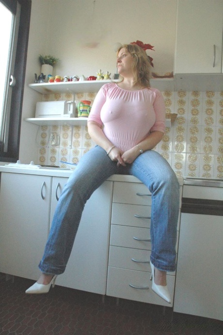 Bored housewife Davina unveils her monster melons and plays with them