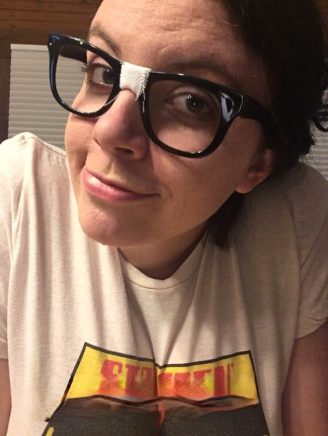 Brunette fatty with eyeglasses Lovely Lilith unleashing her massive knockers