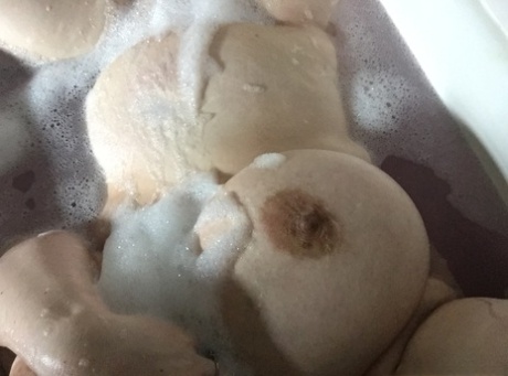 Shameless amateur fatty takes selfies of her big boobs in the bathtub