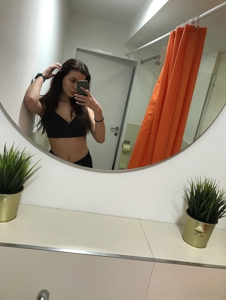 Russian teen Emily Mayers showing her great ass while taking nude selfies