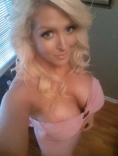 Blonde bombshell Alura Jenson shows her huge boobs and takes selfies at home