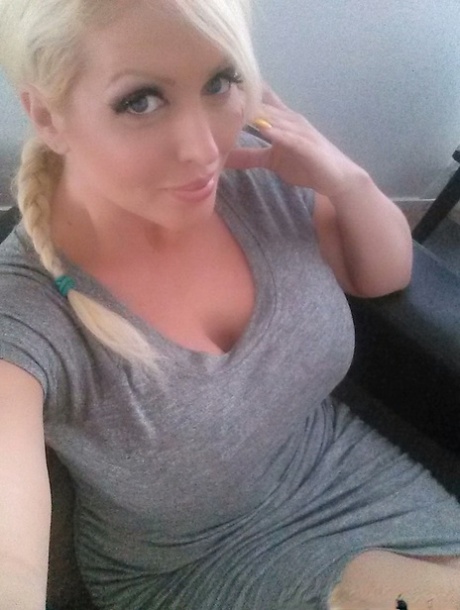 Blonde bombshell Alura Jenson shows her huge boobs and takes selfies at home
