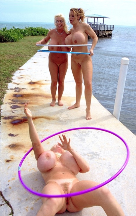 Chesty Sarenna Lee & her GFs with oiled big tits play with dildos at the beach