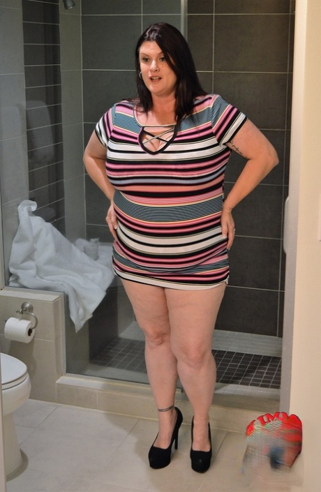 Brunette BBW Kimmie Kaboom plays with her big boobs & milk in the shower