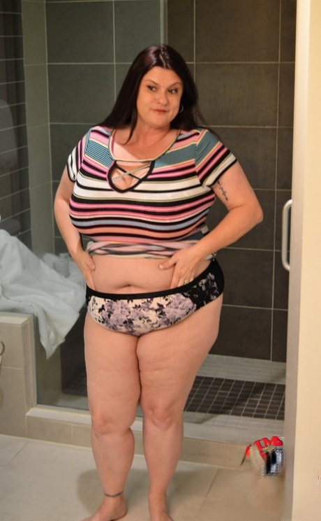 Brunette BBW Kimmie Kaboom plays with her big boobs & milk in the shower