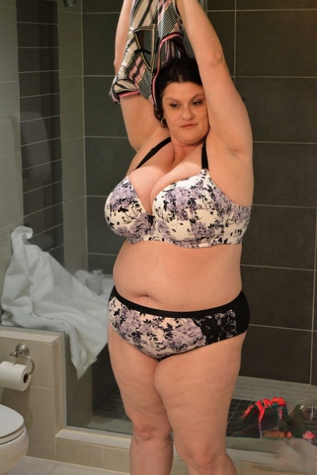 Brunette BBW Kimmie Kaboom plays with her big boobs & milk in the shower