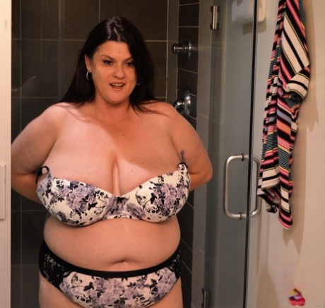 Brunette BBW Kimmie Kaboom plays with her big boobs & milk in the shower