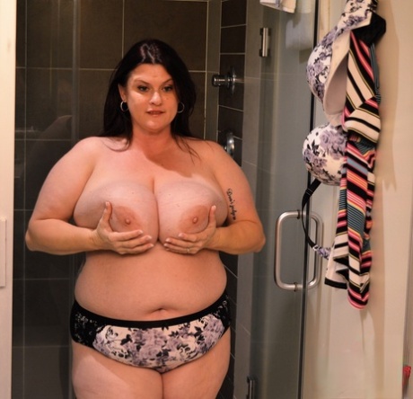 Brunette BBW Kimmie Kaboom plays with her big boobs & milk in the shower