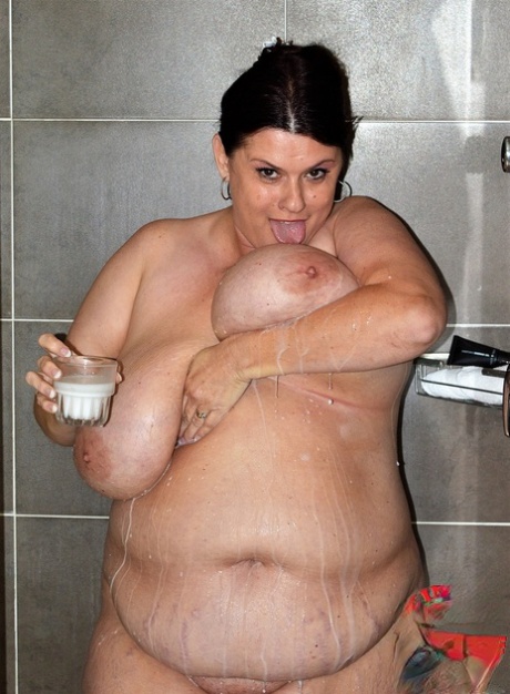 Brunette BBW Kimmie Kaboom plays with her big boobs & milk in the shower