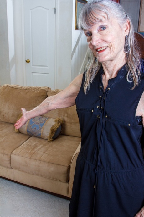 Gorgeous granny Candis strips naked and pounds her pussy with a toy