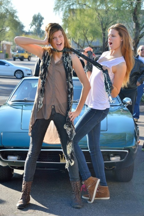 Two frisky teenage babes Raylene & Romi strip in public & pose nude