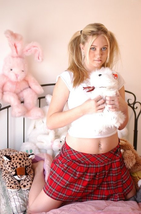 Schoolgirl Alison licks her natural tits and exposes her pink twat close up