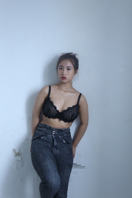 Kinky Asian honey poses completely nude and teases with her big tits and ass