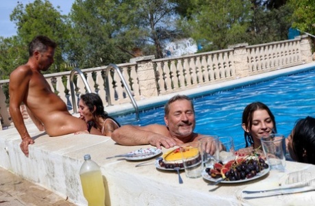 Naughty teens in bikinis enjoy hardcore sex in a sizzling poolside orgy