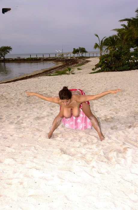 Horny brunette mom Chloe Vevrier lets out her big tits & hairy twat on a beach