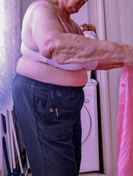Chubby granny Lavinia strips completely naked and shows her saggy tits
