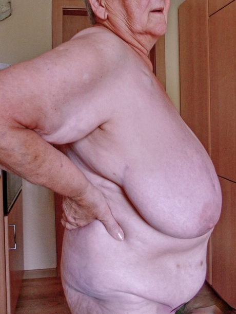 Chubby granny Lavinia strips completely naked and shows her saggy tits