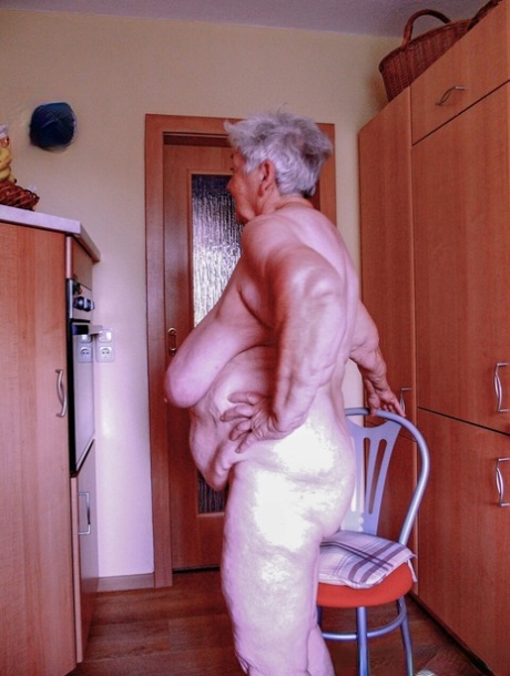 Chubby granny Lavinia strips completely naked and shows her saggy tits