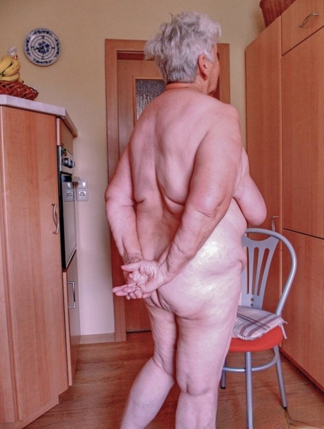 Chubby granny Lavinia strips completely naked and shows her saggy tits