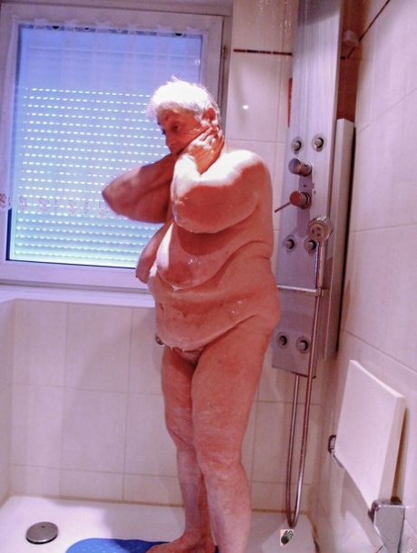 Chubby granny Lavinia strips completely naked and shows her saggy tits