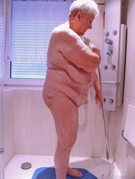 Chubby granny Lavinia strips completely naked and shows her saggy tits