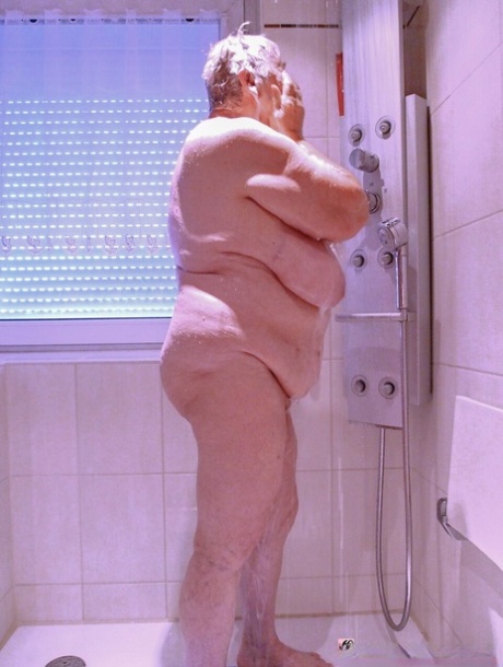 Chubby granny Lavinia strips completely naked and shows her saggy tits