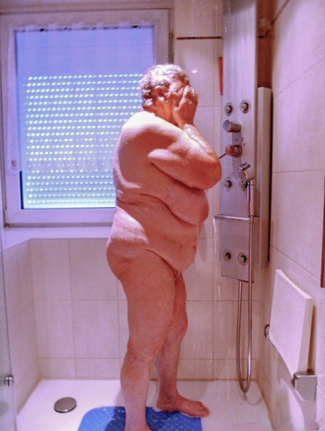 Chubby granny Lavinia strips completely naked and shows her saggy tits