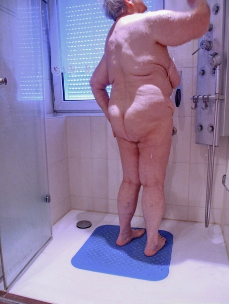 Chubby granny Lavinia strips completely naked and shows her saggy tits