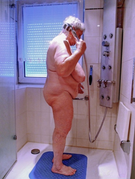 Chubby granny Lavinia strips completely naked and shows her saggy tits