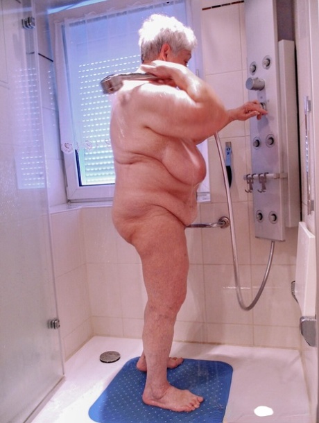 Chubby granny Lavinia strips completely naked and shows her saggy tits