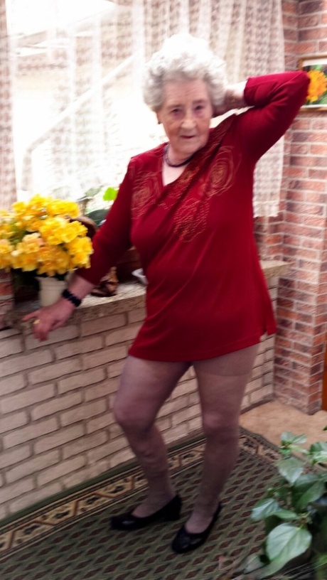 Short-haired granny Pitschka undressing and showing her saggy boobs