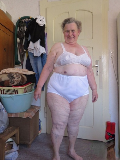 Short-haired granny Advotia displays her saggy tits in her solo compilation