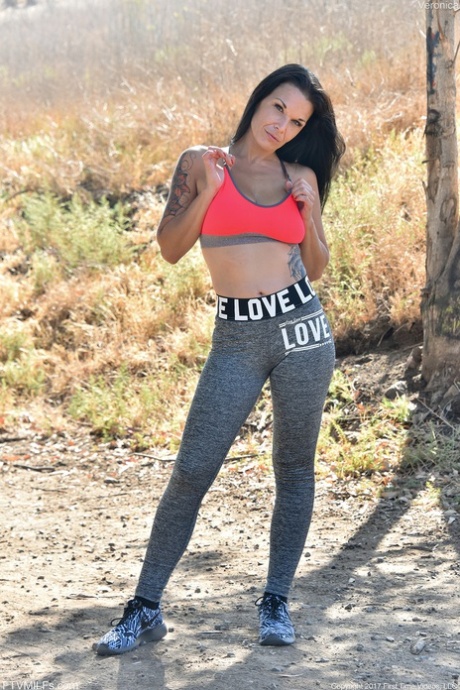 Brunette mature in yoga pants Veronica unveils her amazing big tits outdoors