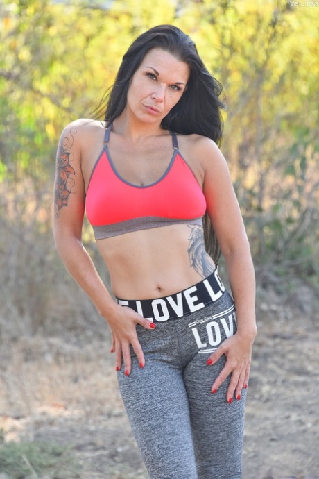 Brunette mature in yoga pants Veronica unveils her amazing big tits outdoors