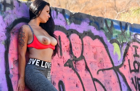 Brunette mature in yoga pants Veronica unveils her amazing big tits outdoors