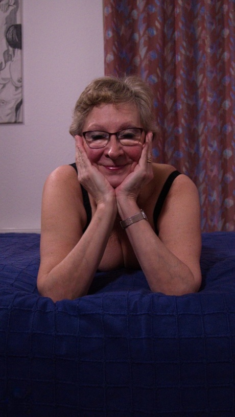 Chubby German granny Angie teasing in black lingerie & stockings