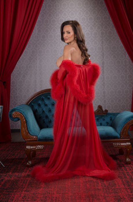 MILF Lisa Ann doffs her red robe to reveal her big tits and gets blacked